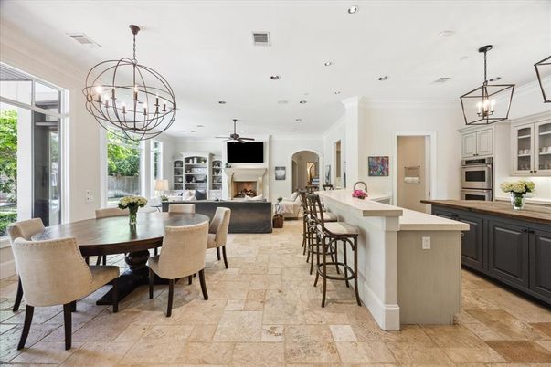 Chandelier, Dining room, Fireplace, Interior, Kitchen, Living room, Pendant Lights, Recessed Lighting, Stainless Steel Appliances