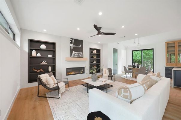 Dining room, Fireplace, Interior, Living room, Recessed Lighting, Wood Texture Flooring