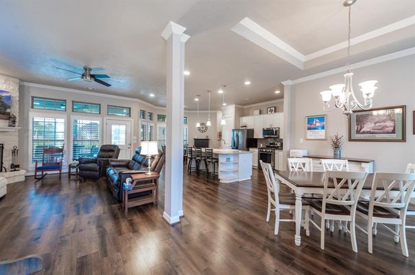 Chandelier, Dining room, Interior, Kitchen, Living room, Pendant Lights, Recessed Lighting, Stainless Steel Appliances, Wood Texture Flooring