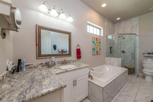 Bathroom, Dual Sink Vanities, Glass Shower, Interior, Marble, Marble Walls, Recessed Lighting