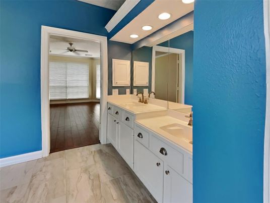 Bathroom, Dual Sink Vanities, Interior, Marble, Recessed Lighting, Wood Texture Flooring
