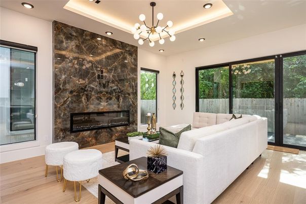 Fireplace, Interior, Living room, Marble Walls, Pendant Lights, Recessed Lighting, Wood Texture Flooring