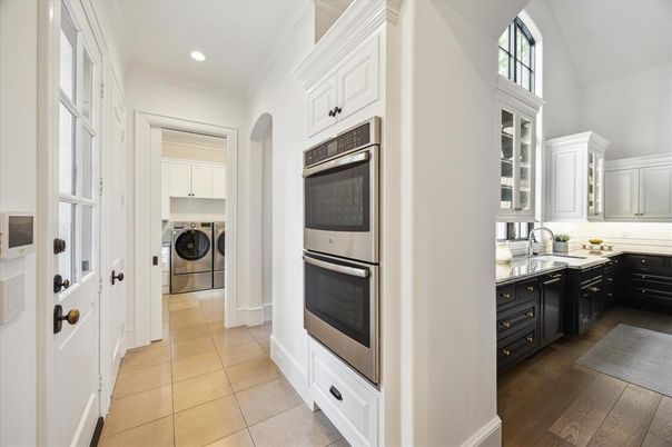 Interior, Kitchen, Recessed Lighting, Washer, Wood Texture Flooring