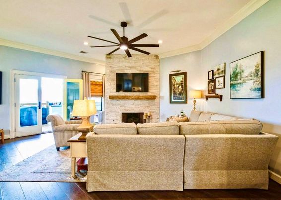 Fireplace, Interior, Living room, Recessed Lighting, Stone Walls, Wood Texture Flooring