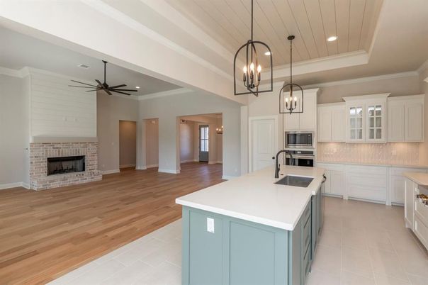 Fireplace, Interior, Kitchen, Pendant Lights, Recessed Lighting, Stainless Steel Appliances, Wood Texture Flooring