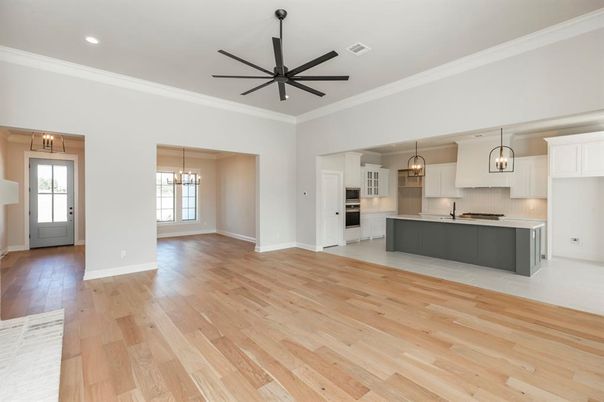 Empty room, Interior, Kitchen, Pendant Lights, Recessed Lighting, Stainless Steel Appliances, Wood Texture Flooring