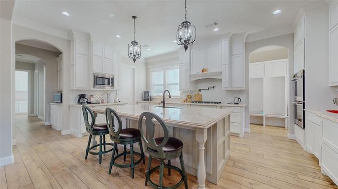 Chandelier, Interior, Kitchen, Pendant Lights, Recessed Lighting, Stainless Steel Appliances, Wood Texture Flooring