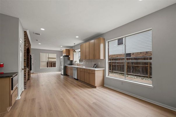Interior, Kitchen, Pendant Lights, Recessed Lighting, Stainless Steel Appliances, Wood Texture Flooring