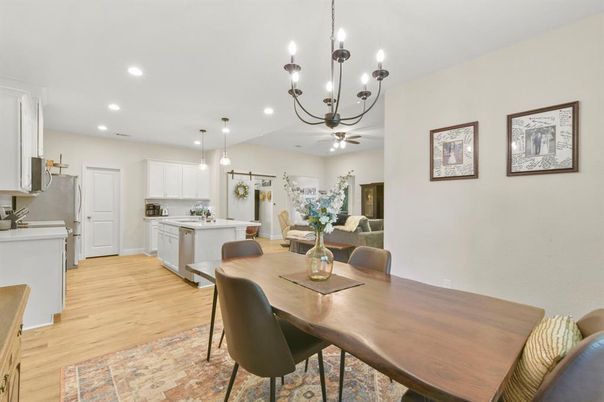 Chandelier, Dining room, Interior, Kitchen, Pendant Lights, Recessed Lighting, Stainless Steel Appliances, Wood Texture Flooring