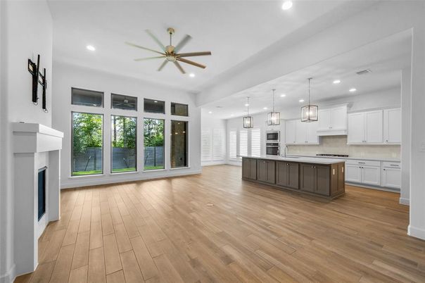 Empty room, Fireplace, Interior, Kitchen, Pendant Lights, Recessed Lighting, Wood Texture Flooring