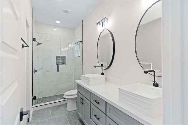 Bathroom, Dual Sink Vanities, Glass Shower, Interior, Marble Walls, Recessed Lighting