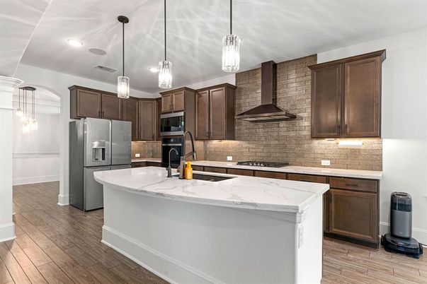 Interior, Kitchen, Pendant Lights, Recessed Lighting, Stainless Steel Appliances, Stone Walls, Wood Texture Flooring