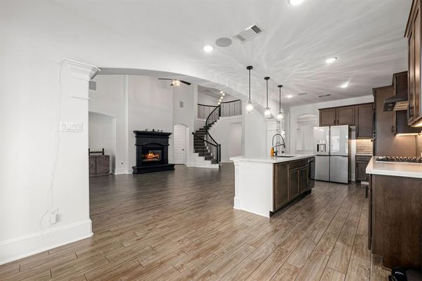 Fireplace, Interior, Kitchen, Pendant Lights, Recessed Lighting, Wood Texture Flooring