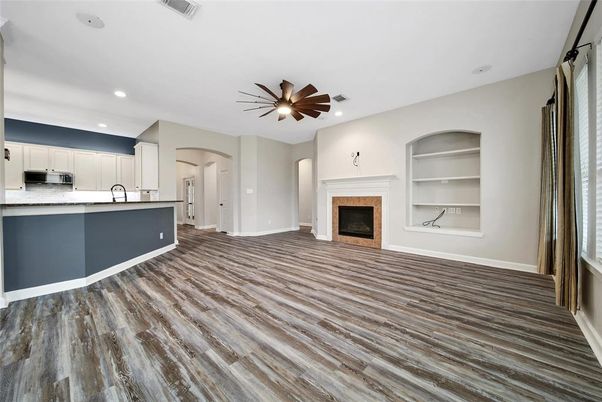 Empty room, Fireplace, Interior, Kitchen, Recessed Lighting, Wood Texture Flooring