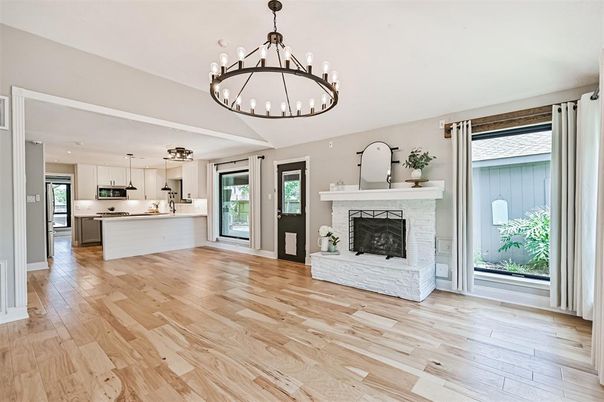 Chandelier, Empty room, Fireplace, Interior, Kitchen, Pendant Lights, Recessed Lighting, Wood Texture Flooring