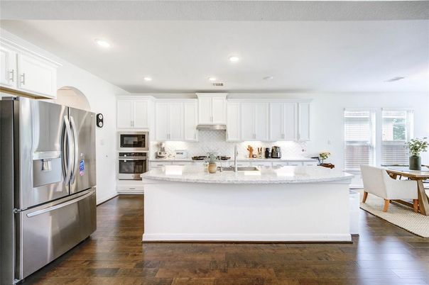 Dining room, Interior, Kitchen, Recessed Lighting, Stainless Steel Appliances, Wood Texture Flooring