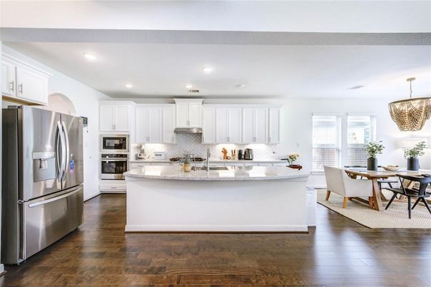 Chandelier, Dining room, Interior, Kitchen, Recessed Lighting, Stainless Steel Appliances, Wood Texture Flooring