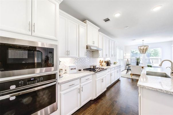 Dining room, Interior, Kitchen, Pendant Lights, Recessed Lighting, Stainless Steel Appliances, Wood Texture Flooring