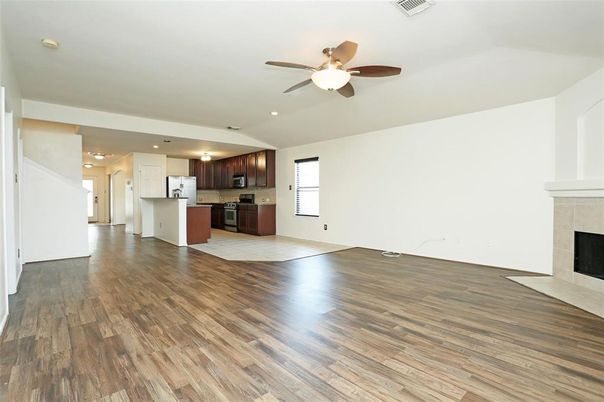 Empty room, Fireplace, Interior, Kitchen, Recessed Lighting, Wood Texture Flooring
