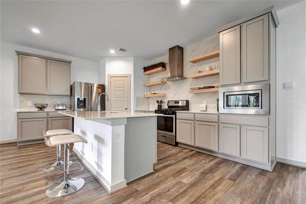 Interior, Kitchen, Marble Walls, Recessed Lighting, Stainless Steel Appliances, Wood Texture Flooring
