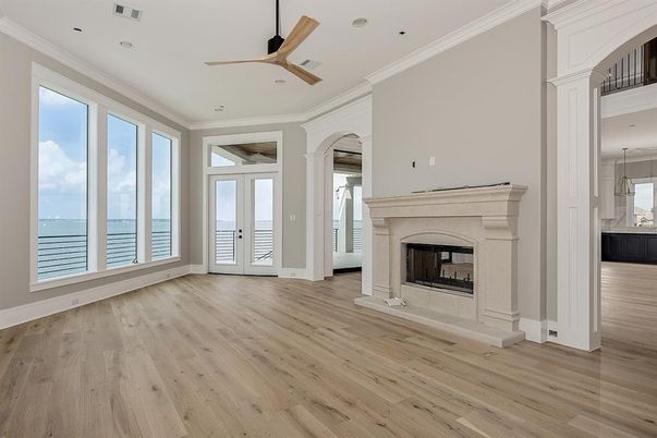 Empty room, Fireplace, Interior, Recessed Lighting, Water, Wood Texture Flooring