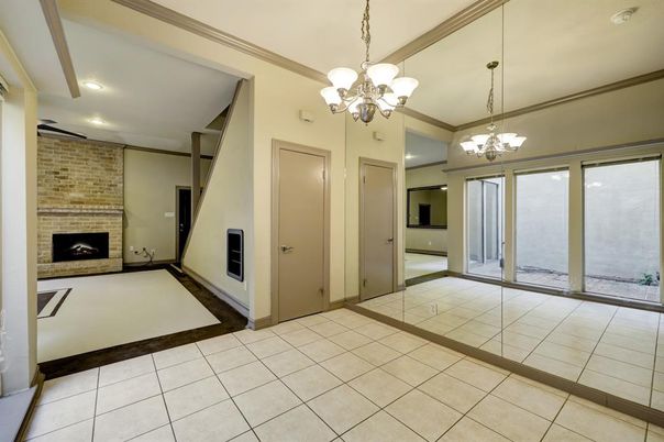 Chandelier, Empty room, Fireplace, Interior, Recessed Lighting, Stone Walls