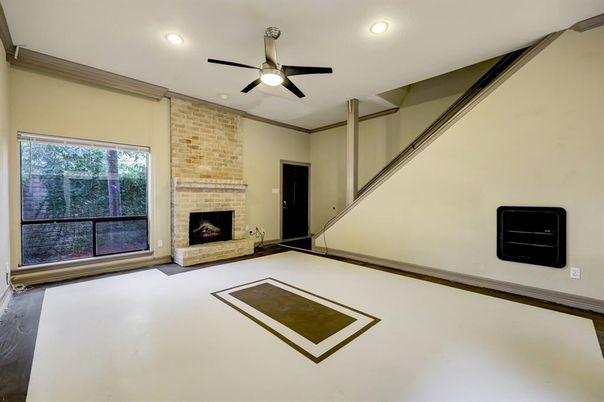 Empty room, Fireplace, Interior, Recessed Lighting, Stone Walls, Wood Texture Flooring