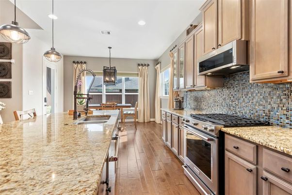 Dining room, Interior, Kitchen, Pendant Lights, Recessed Lighting, Stainless Steel Appliances, Wood Texture Flooring