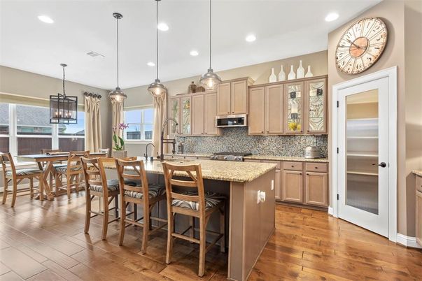 Dining room, Interior, Kitchen, Pendant Lights, Recessed Lighting, Stainless Steel Appliances, Wood Texture Flooring