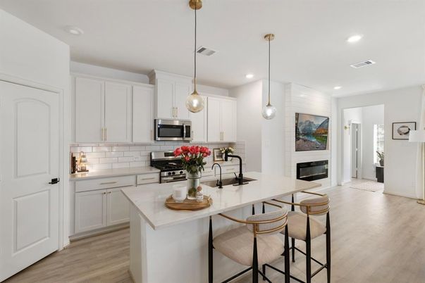 Fireplace, Interior, Kitchen, Pendant Lights, Recessed Lighting, Stainless Steel Appliances, Wood Texture Flooring