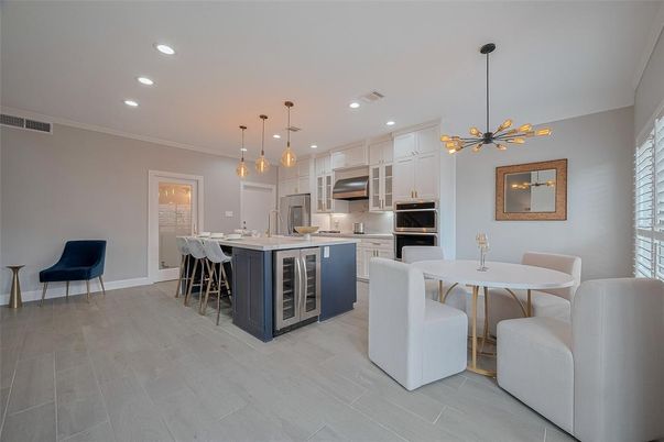 Dining room, Interior, Kitchen, Pendant Lights, Recessed Lighting, Stainless Steel Appliances, Wood Texture Flooring