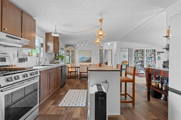 Dining room, Interior, Kitchen, Pendant Lights, Stainless Steel Appliances, Wood Texture Flooring