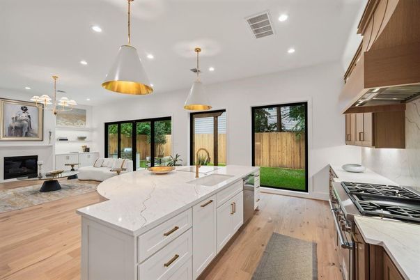 Fireplace, Interior, Kitchen, Living room, Pendant Lights, Recessed Lighting, Stainless Steel Appliances, Wood Texture Flooring