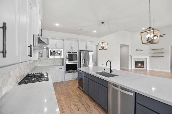 Fireplace, Interior, Kitchen, Pendant Lights, Recessed Lighting, Stainless Steel Appliances, Wood Texture Flooring