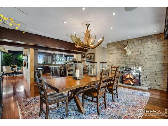Chandelier, Dining room, Fireplace, Interior, Recessed Lighting, Stone Walls, Wood Texture Flooring
