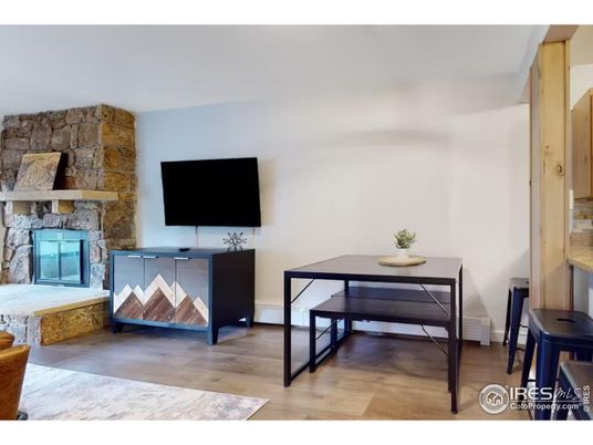 Dining room, Fireplace, Interior, Stone Walls, Wood Texture Flooring