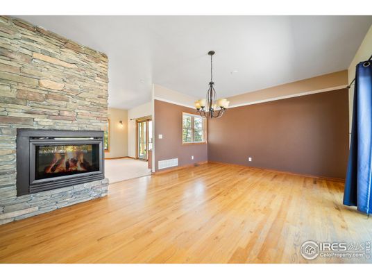 Chandelier, Empty room, Fireplace, Interior, Pendant Lights, Stone Walls, Wood Texture Flooring