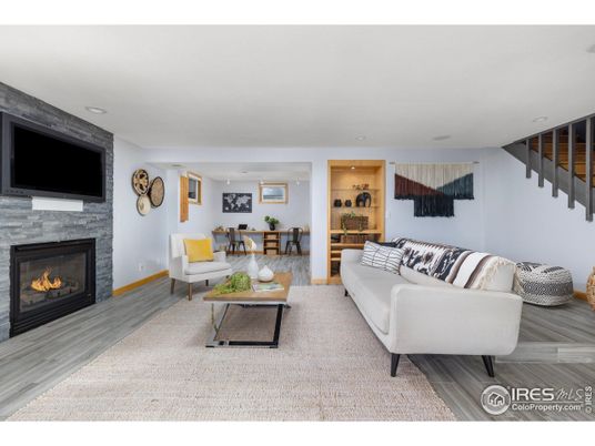 Dining room, Fireplace, Interior, Living room, Recessed Lighting, Wood Texture Flooring