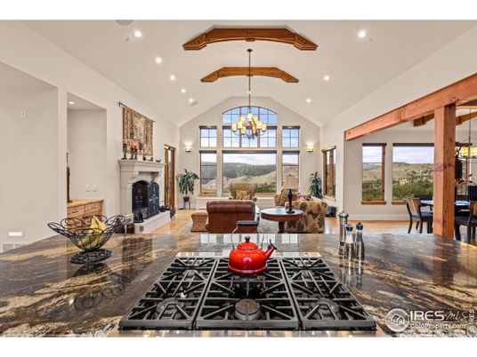 Chandelier, Dining room, Fireplace, Interior, Kitchen, Living room, Recessed Lighting, Wooden Beams