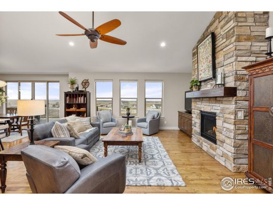 Fireplace, Interior, Living room, Recessed Lighting, Stone Walls, Wood Texture Flooring