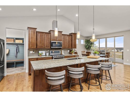 Dining room, Interior, Kitchen, Pendant Lights, Recessed Lighting, Stainless Steel Appliances, Wood Texture Flooring