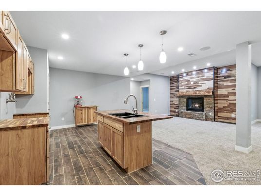 Fireplace, Interior, Kitchen, Pendant Lights, Recessed Lighting, Wood Texture Flooring, Wooden Walls