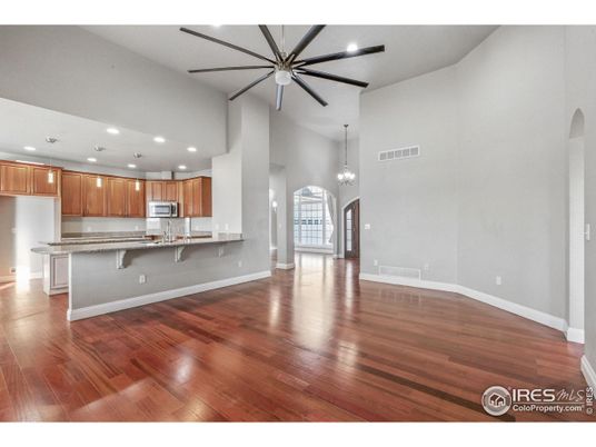 Chandelier, Empty room, Interior, Kitchen, Pendant Lights, Recessed Lighting, Stainless Steel Appliances, Wood Texture Flooring