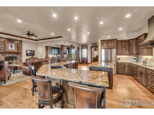 Fireplace, Interior, Kitchen, Living room, Recessed Lighting, Stainless Steel Appliances, Stone Walls, Wood Texture Flooring
