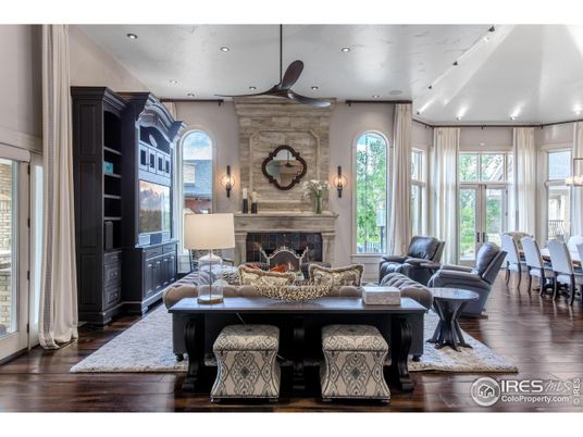 Dining room, Fireplace, Interior, Living room, Recessed Lighting, Stone Walls, Wood Texture Flooring