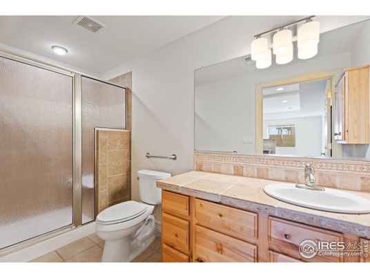 Bathroom, Dual Sink Vanities, Glass Shower, Interior, Recessed Lighting, Tile Countertops