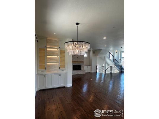 Chandelier, Empty room, Fireplace, Interior, Recessed Lighting, Wood Texture Flooring