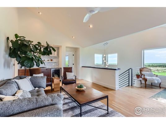 Fireplace, Interior, Living room, Recessed Lighting, Stone Walls, Water, Wood Texture Flooring