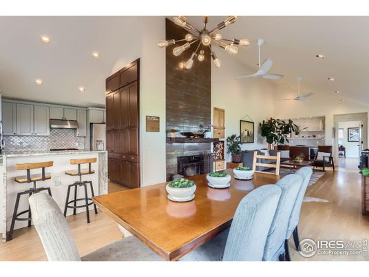 Dining room, Fireplace, Interior, Kitchen, Pendant Lights, Recessed Lighting, Stainless Steel Appliances, Wood Texture Flooring