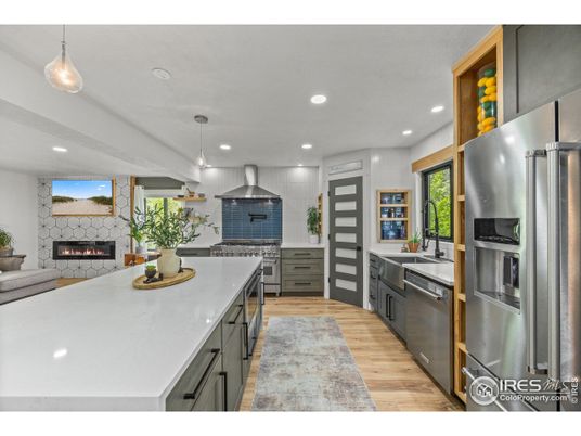 Fireplace, Interior, Kitchen, Pendant Lights, Recessed Lighting, Stainless Steel Appliances, Wood Texture Flooring